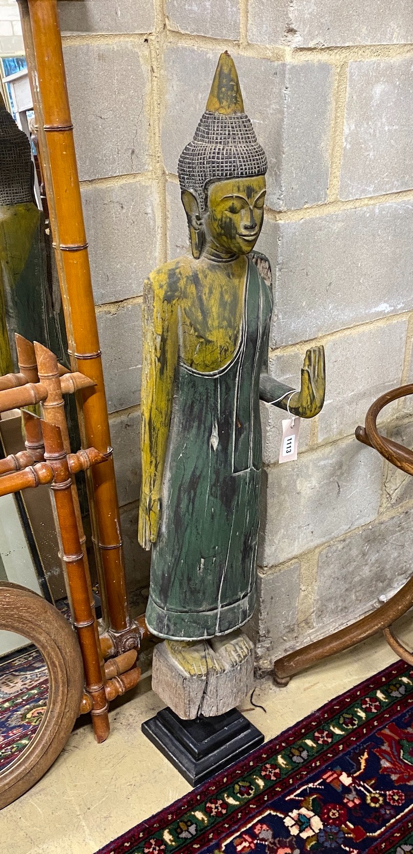 A painted carved wood standing Buddha ornament, height 116cm